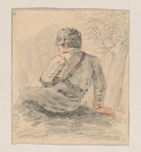 Garçon assis, vu de dos