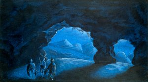 Trois personnes dans une grotte dans les montagnes