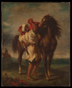 Arabe sellant son cheval
