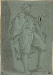 Homme debout avec bâton