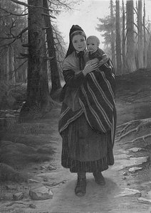 Mère et enfant sur un chemin boisé