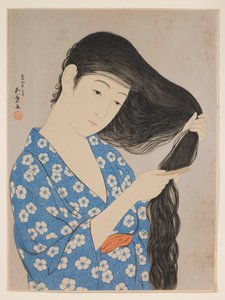 Femme se peignant les cheveux