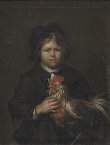 Un garçon de ferme avec un coq