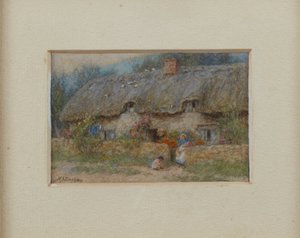 Cottage au toit de chaume gris