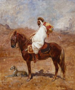 Un Arabe à cheval dans un paysage désertique