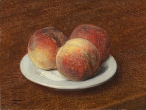 Trois pêches sur une assiette