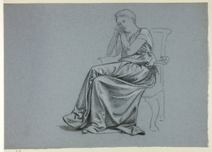 Femme en robe ample sur une chaise