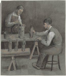 Deux ouvriers fabriquant des figurines