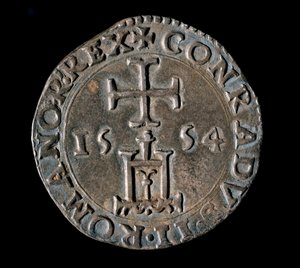 Monnaie de la République de Gênes : teston en argent de la Bénédiction. Recto représentant le portail de Gênes sous une croix. 1554 Gênes, Musei di Strada Nuova