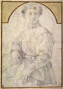 Un jeune homme assis portant un bonnet