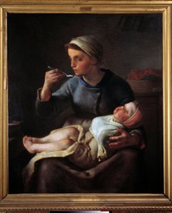 Femme nourrissant son enfant
