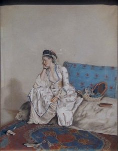 Dame pensive sur un sofa