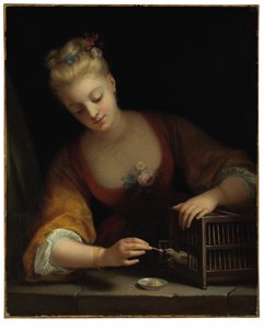 Jeune fille faisant manger des oiseaux