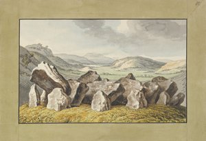 Un cercle de pierres préhistoriques sur un monticule, un paysage étendu au-delà