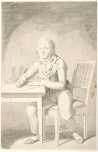 Jeune garçon écrivant assis à une table