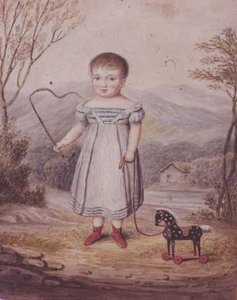 Fille avec un cheval jouet