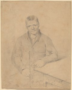 Homme assis à une table