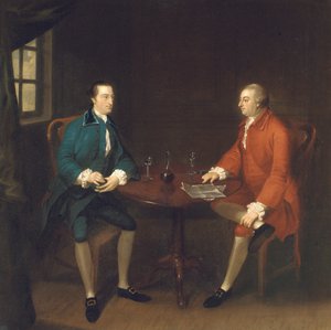 Deux messieurs assis à une table