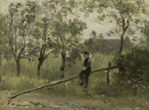 Garçon de campagne sur une barrière
