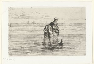 Enfants jouant avec un bateau sur la plage