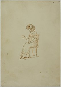 Fille assise tenant une tasse de thé