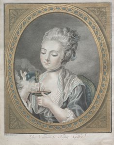 La femme prenant du café