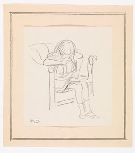 Fille assise dans un fauteuil et lisant