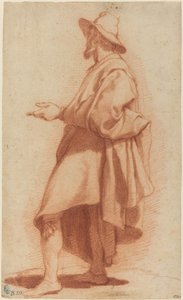 Homme Debout Portant un Manteau et un Chapeau