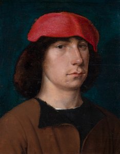 Un jeune homme avec une casquette rouge