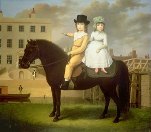 Deux enfants assis sur un poney noir