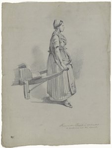 Femme debout tirant une charrette à Utrecht