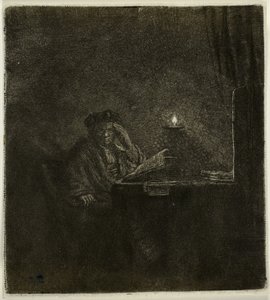 Étudiant à une table à la lumière d