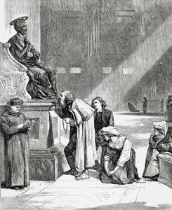 Personnes embrassant les pieds de la statue de Saint Pierre à l