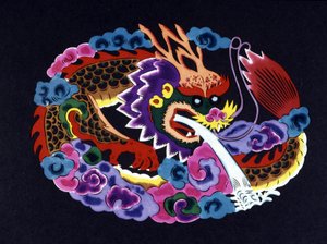 Découpe de papier chinois coloré avec un dragon