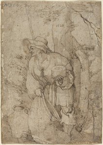 Vieil homme debout sous un arbre