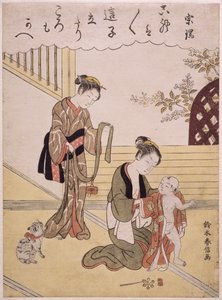 Une mère habillant son jeune fils en kimono