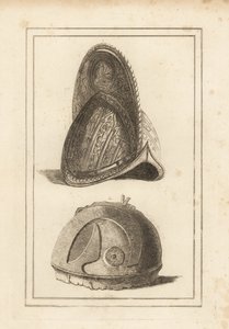 Ancien casque morion vénitien orné de trophées militaires, et un ancien casque romain trouvé à Cannes