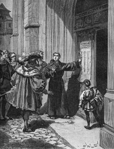 Martin Luther (1483-1546) accrochant ses 95 thèses à Wittenberg