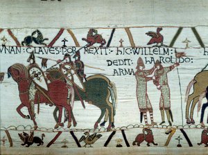 La conquête de la Bretagne par le duc de Normandie Guillaume le Conquérant (1027-1087) : à gauche le duc reçoit les clés de la ville de Dinan, à droite il fait chevalier Harold, envoyé par le roi anglais Édouard le Confesseur (détail de la tapisserie de Ba