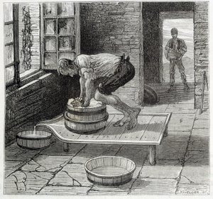 Travail de la Tomme par un fromager d