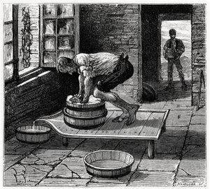 Travail de la tomme par un fromager d