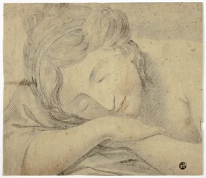 Femme endormie avec la tête sur les bras