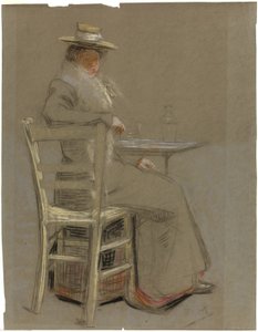 Femme assise à une table