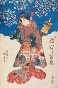 Femme en kimono avec marionnette et fond décoré de fleurs de pommier