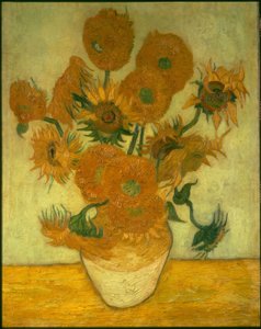 Quatorze tournesols dans un vase