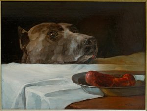 Dogge avec un plat de saucisses