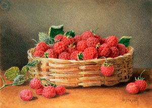 Nature morte de framboises dans un panier en osier