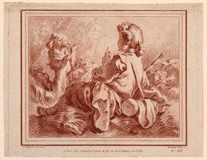 Berger assis jouant avec un chien