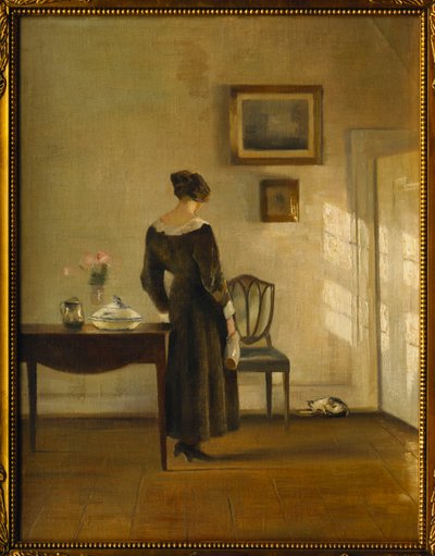 Un Intérieur avec une Femme nourrissant un Chat - Carl Holsoe