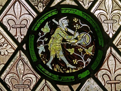 Fenêtre S1 représentant les Travaux des Mois - homme effrayant les oiseaux - English School